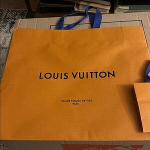 Louis Vuitton Orange Bag with Blue Handles. One large and one small